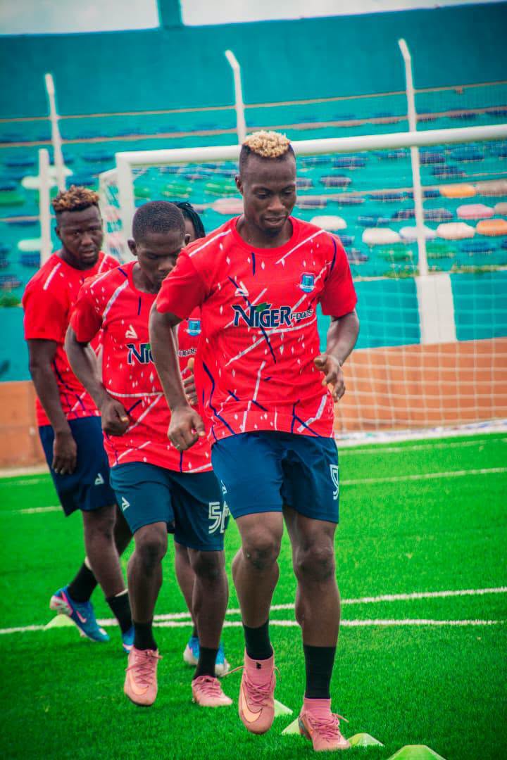 Niger Tornadoes players wearing the club's red match kit