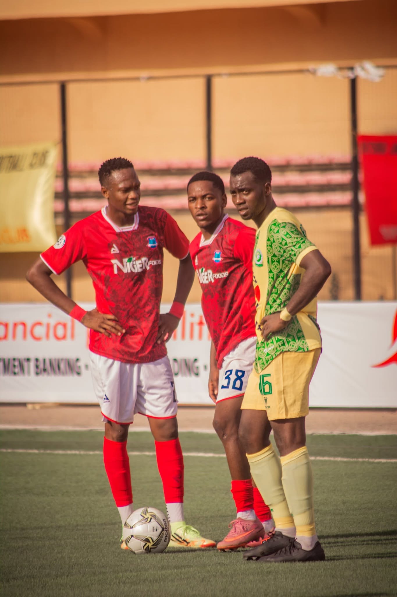 Niger Tornadoes players warm up with the ball on the training pitch