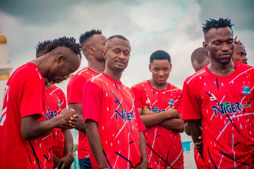 Niger Tornadoes players in their red match kit