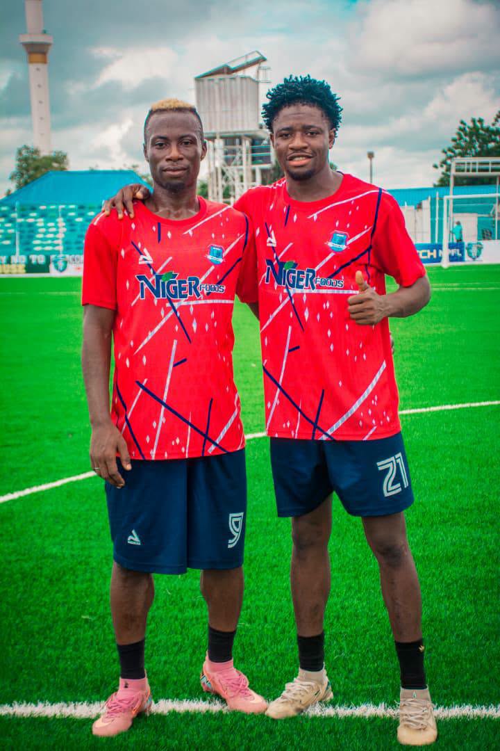 Niger Tornadoes players in red shirts during a club event