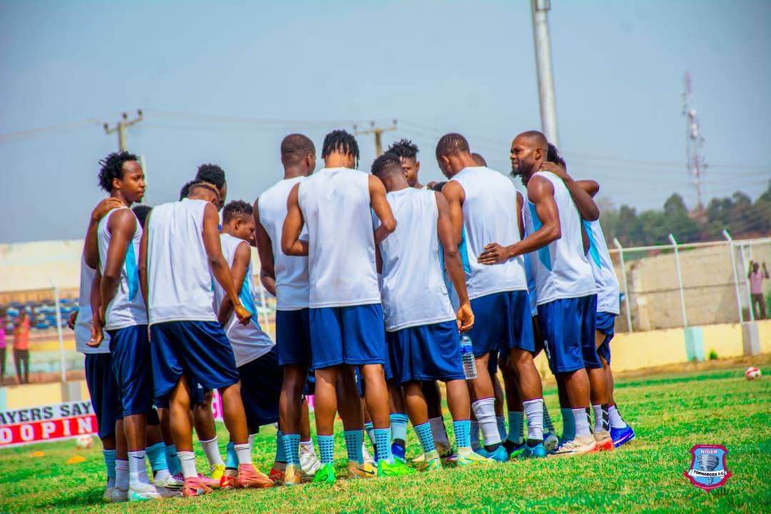 Squad huddled together during training